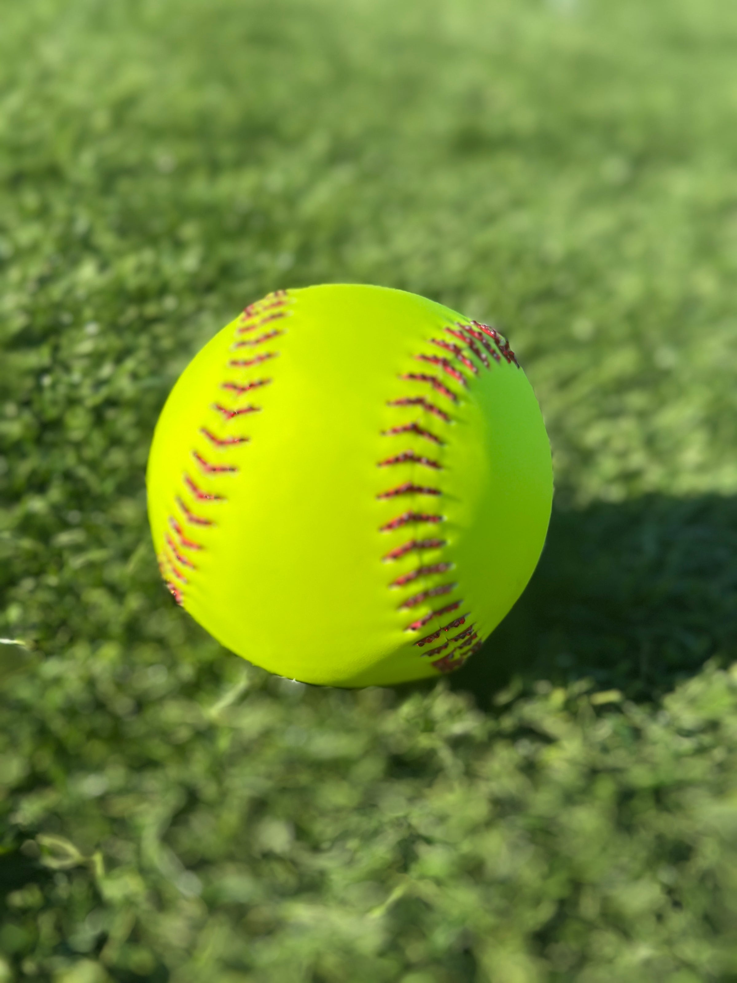 Softball with red rhinestone laces