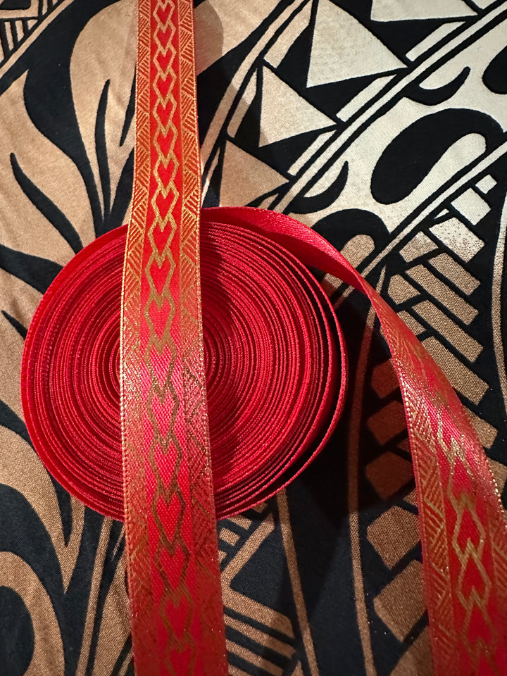 5/8” wide red satin ribbon with metallic gold tribal design